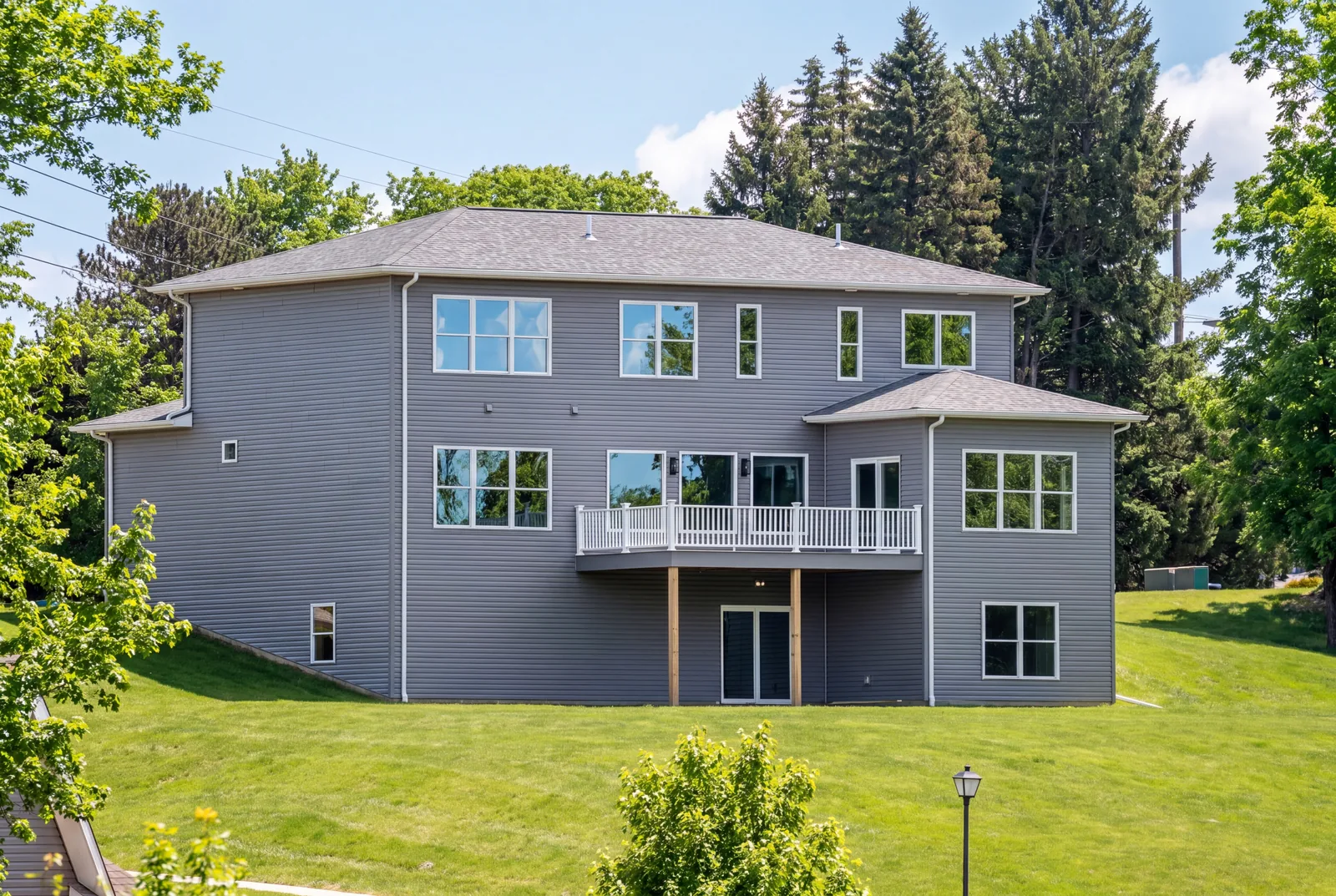The Evergreen Residence — Rear exterior and raised deck