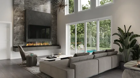 Living room with a gray sectional, tall stone fireplace, starburst light and glass doors facing a pool.